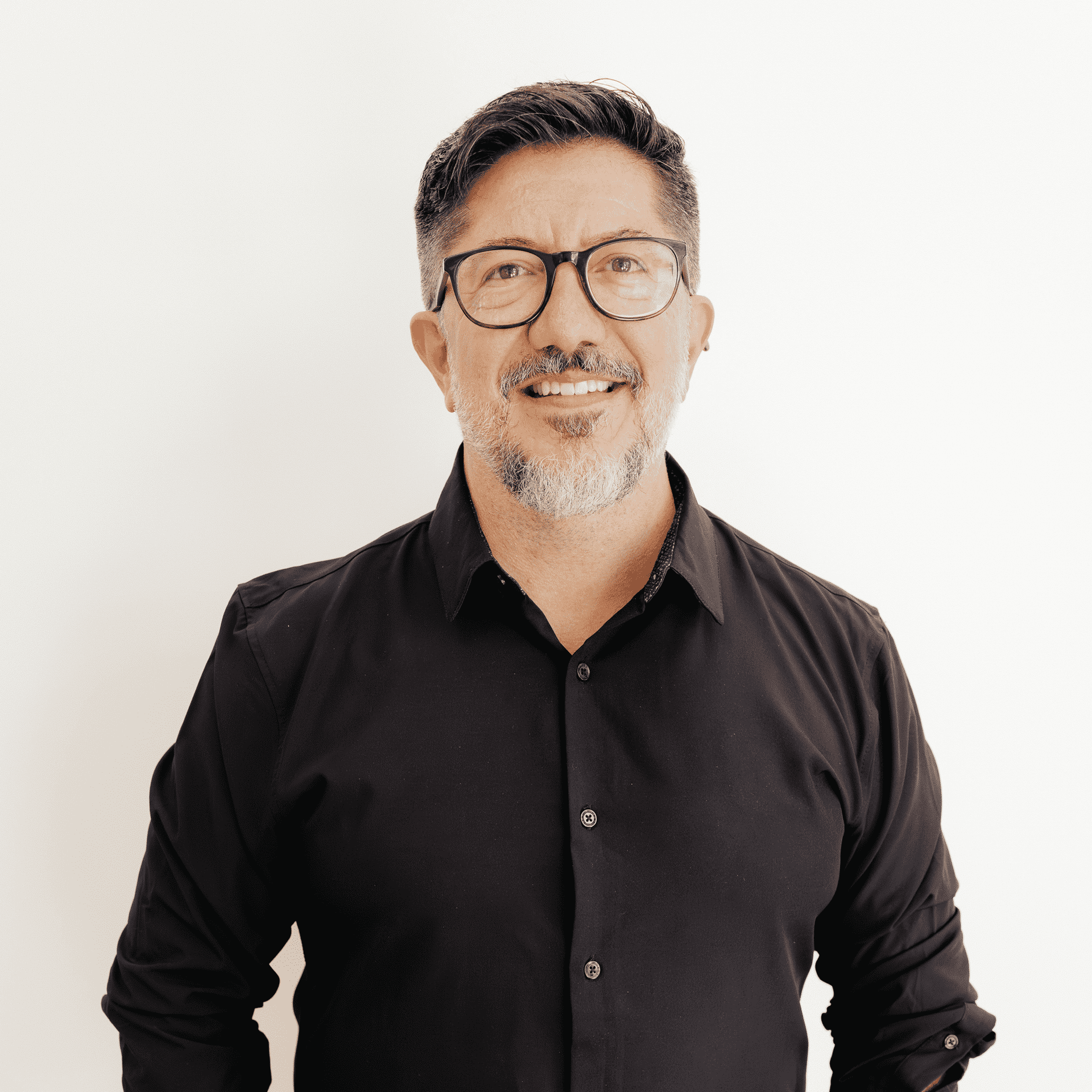Portrait of Giovanny Andrade, a professional stylist at Flying Scissors Salon & Spa, showcasing their expertise and style.
